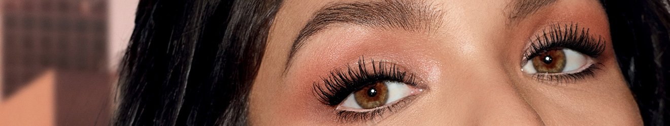 Eye Makeup Tutorials illustrative banner image - close up on woman's Eyes with mascara