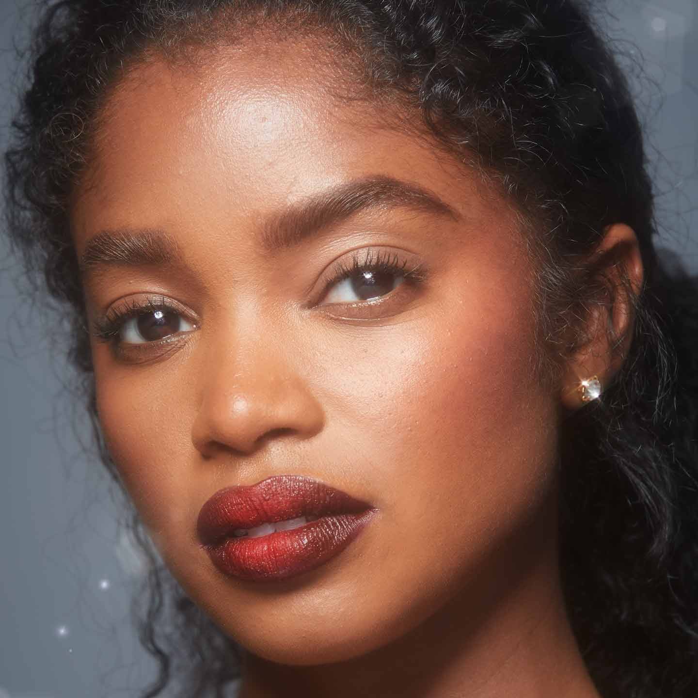 How to Apply Liquid Matte Lipstick model with purple lips