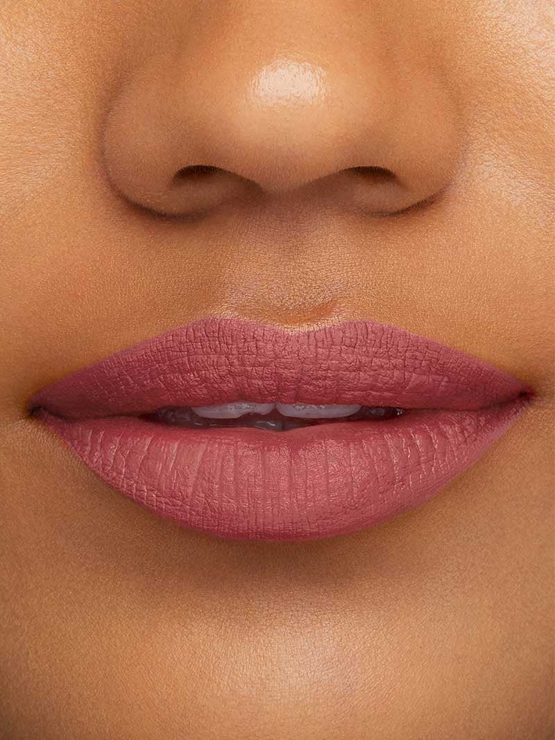 How to Apply Liquid Matte Lipstick model with purple lips